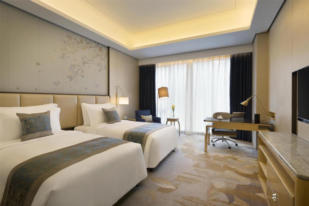 TV a/nebo společenská místnost v ubytování Kempinski Hotel Fuzhou