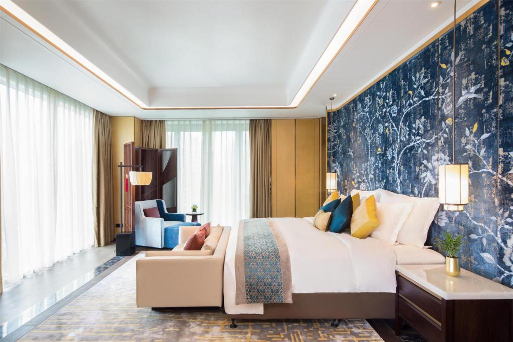 Postel nebo postele na pokoji v ubytování Kempinski Hotel Fuzhou