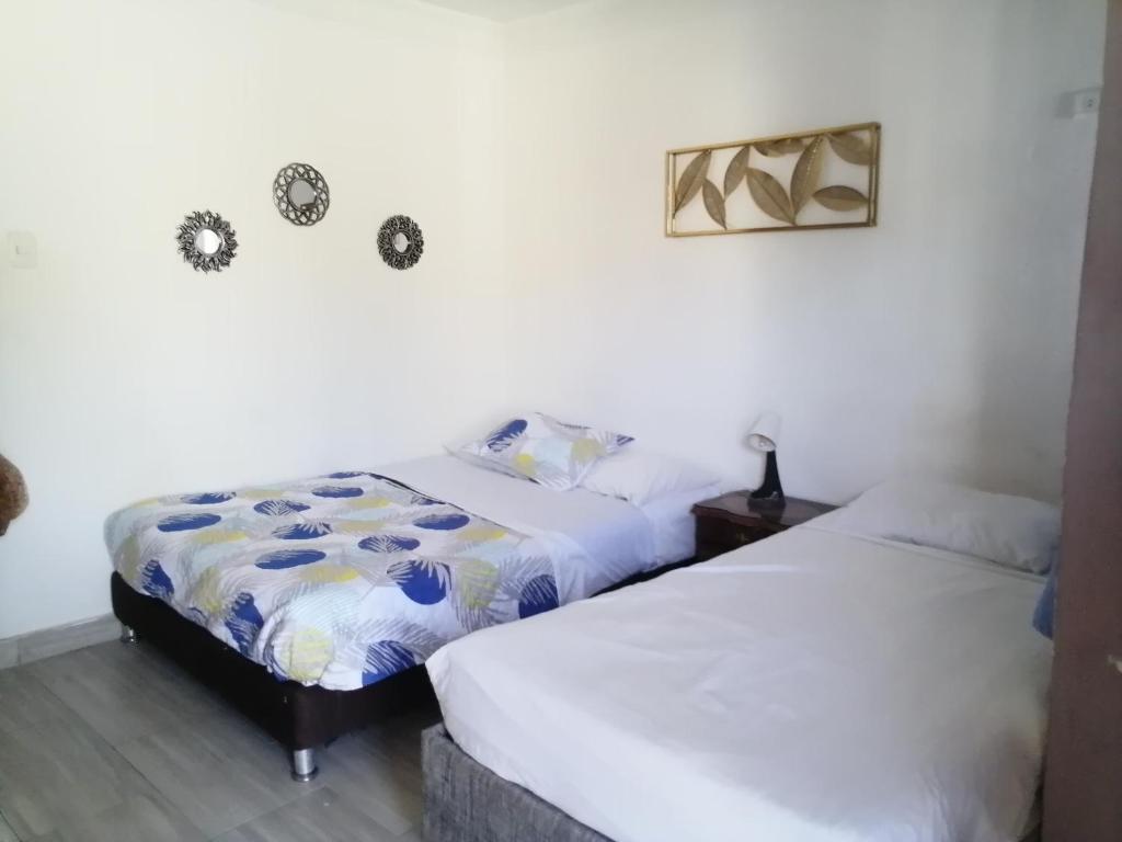 Postel nebo postele na pokoji v ubytování Sai hostels