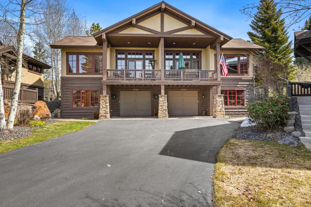 a house with a driveway in front of it at Lady Luck by the Beach - Downtown Greystone unit with air conditioning in McCall