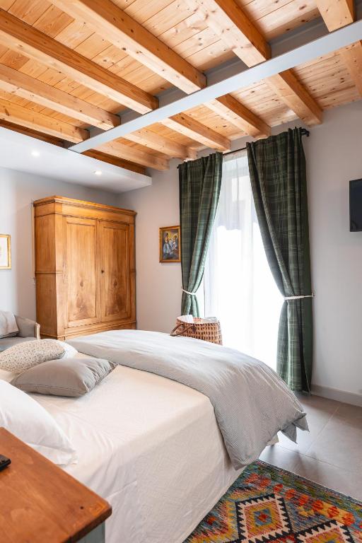 a bedroom with two beds and a window at Palazzo San Biagio in Viterbo