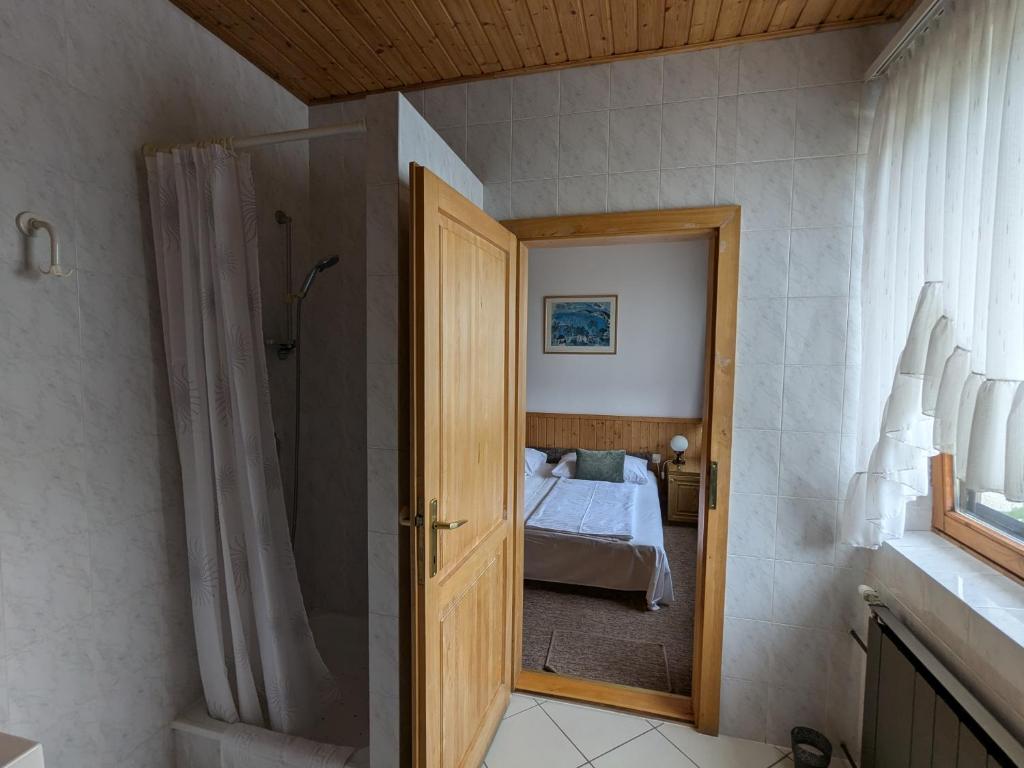 Postel nebo postele na pokoji v ubytování Gründner Vendégház