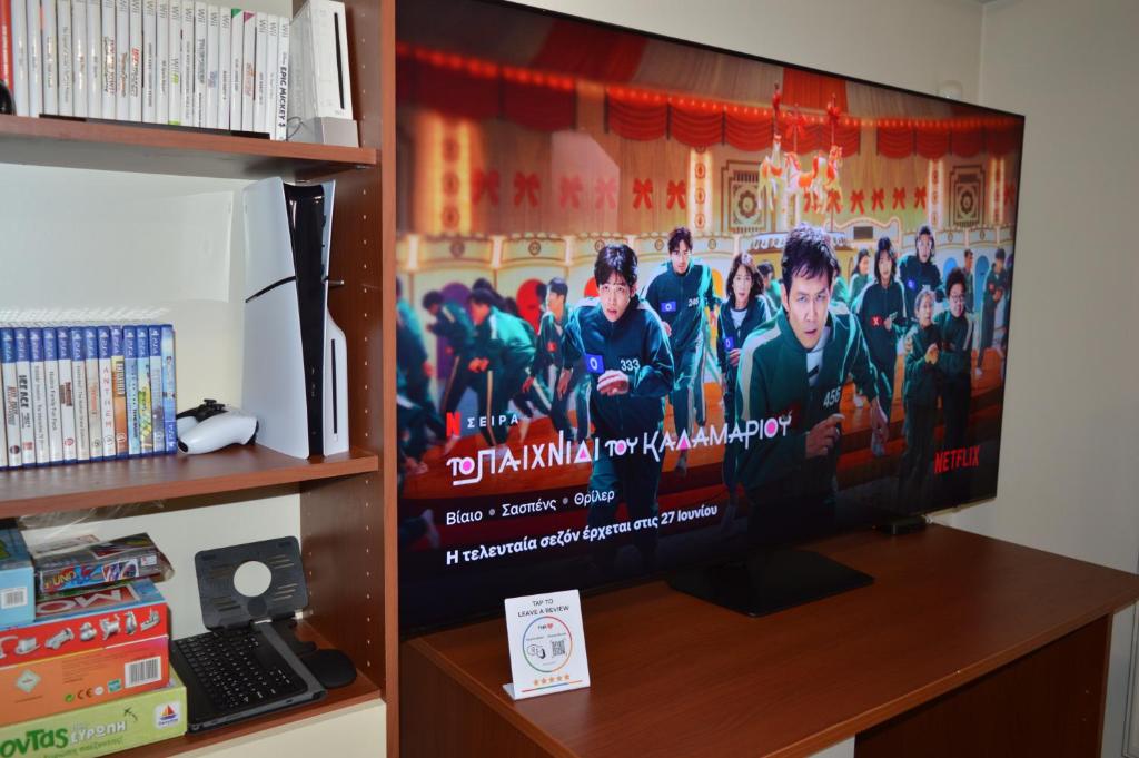 TV a/nebo společenská místnost v ubytování illusion 1