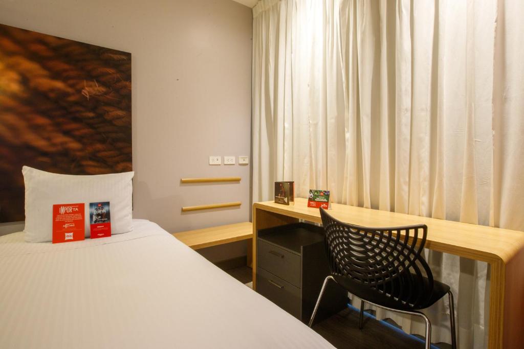 Postel nebo postele na pokoji v ubytování ibis Quito