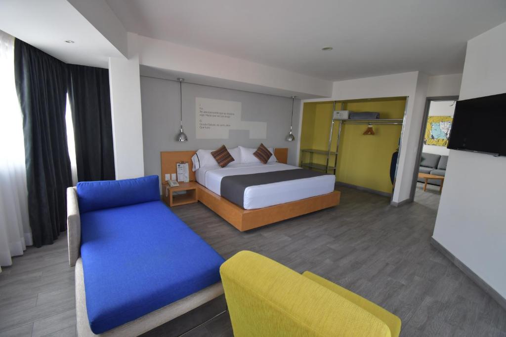 Postel nebo postele na pokoji v ubytování Hotel Perla Central