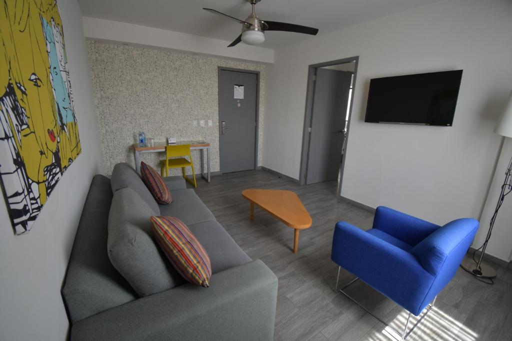 TV a/nebo společenská místnost v ubytování Hotel Perla Central