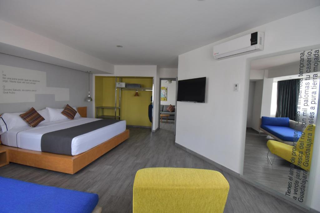 Postel nebo postele na pokoji v ubytování Hotel Perla Central