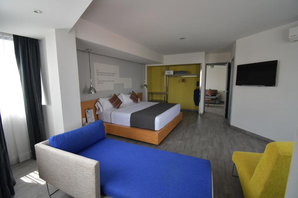 Postel nebo postele na pokoji v ubytování Hotel Perla Central