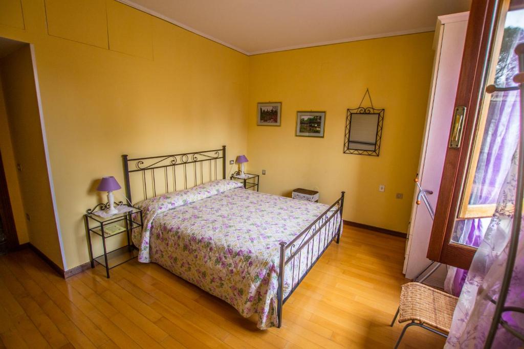 Postel nebo postele na pokoji v ubytování B&B I Narcisi