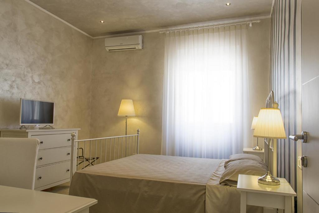 Postel nebo postele na pokoji v ubytování Relais La Pretura