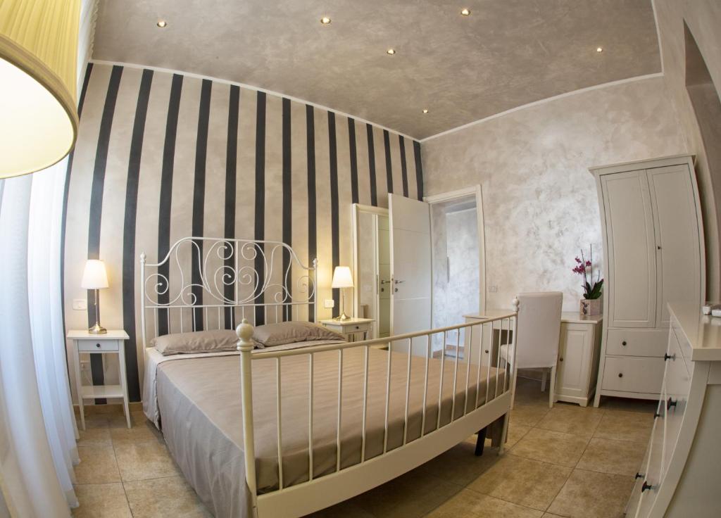 Postel nebo postele na pokoji v ubytování Relais La Pretura