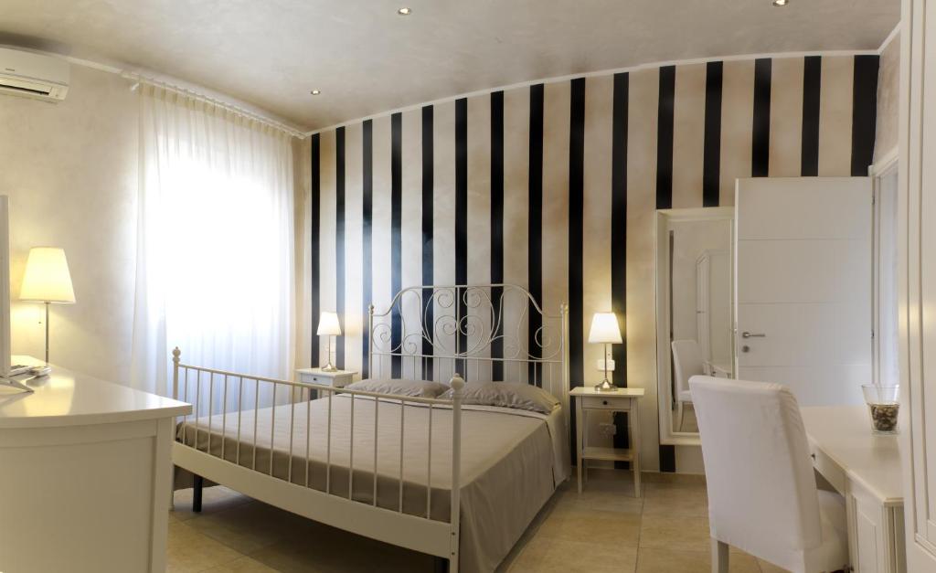 Postel nebo postele na pokoji v ubytování Relais La Pretura