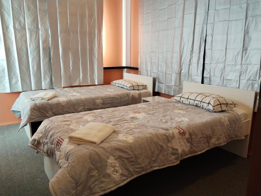Postel nebo postele na pokoji v ubytování YES Guesthouse