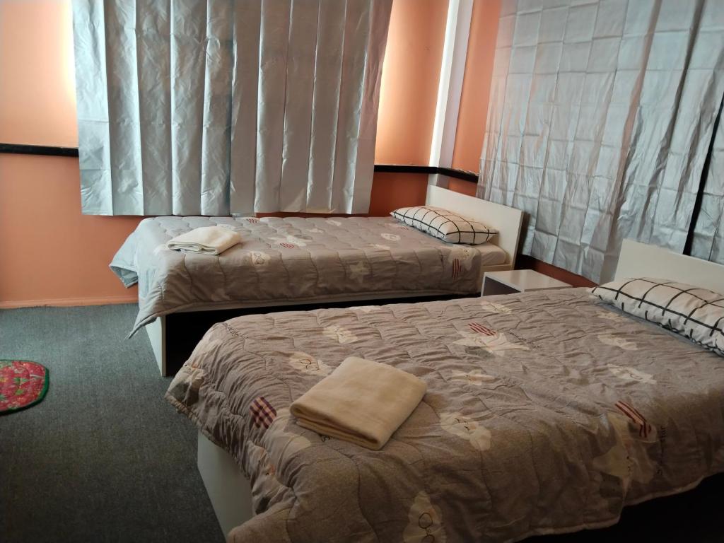 Postel nebo postele na pokoji v ubytování YES Guesthouse