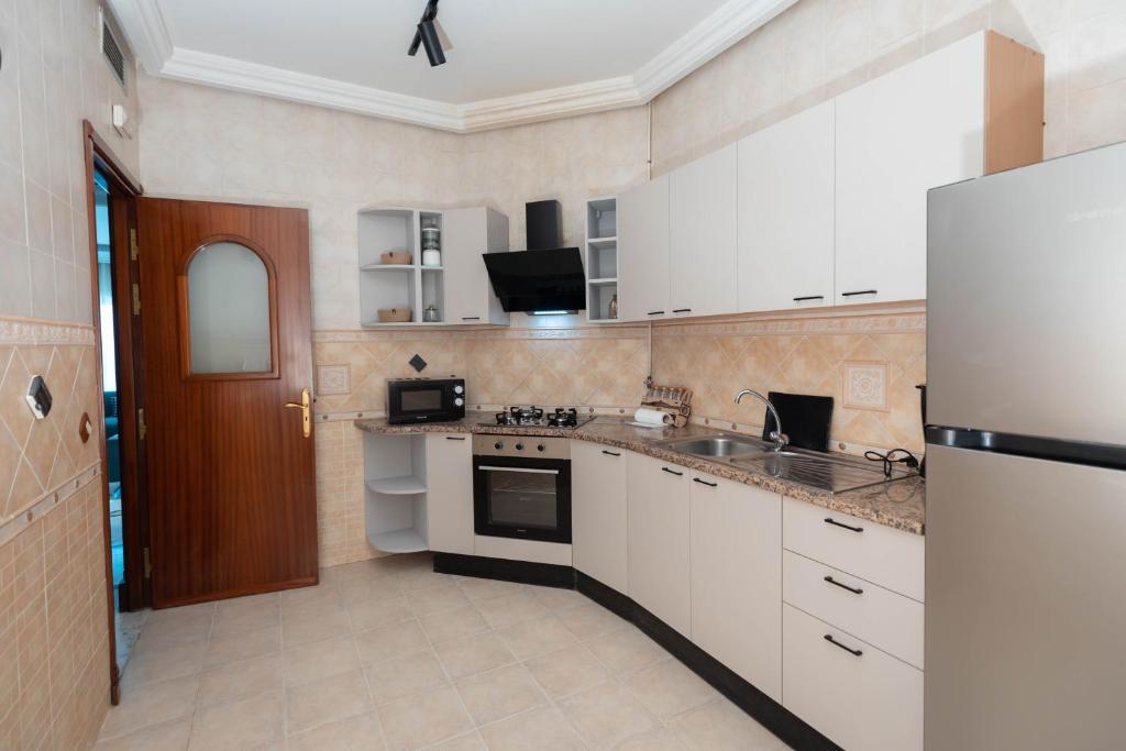 Kuchyň nebo kuchyňský kout v ubytování appart hotel lac 2 Tunis