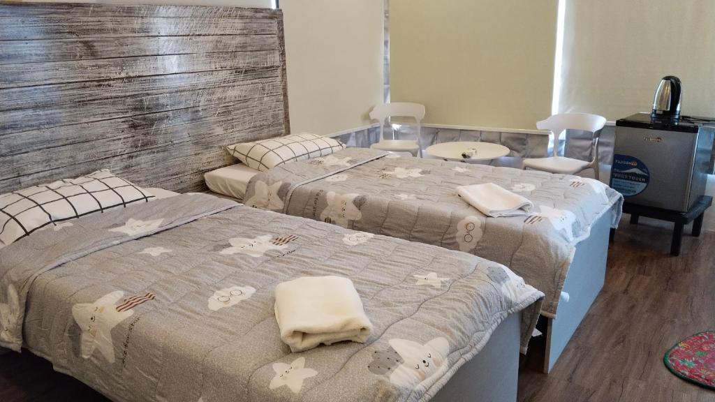Postel nebo postele na pokoji v ubytování YES Guesthouse