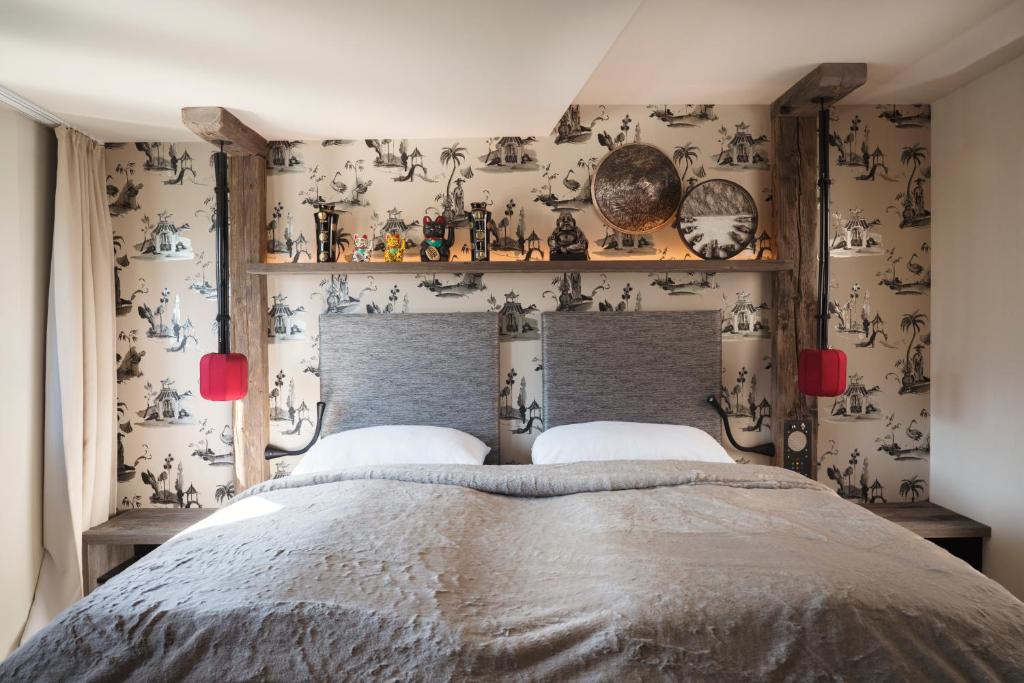 Postel nebo postele na pokoji v ubytování Boutique Hotel im Auracher Löchl