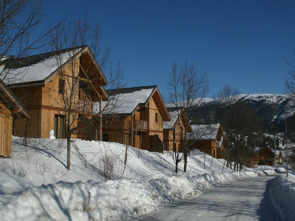 a snow covered road in front of a house at Chalet with shuttle bus in Gresse in Gresse-en-Vercors