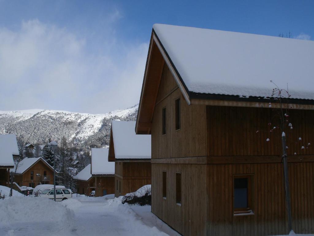a building with snow on top of it at Chalet with shuttle bus in Gresse in Gresse-en-Vercors