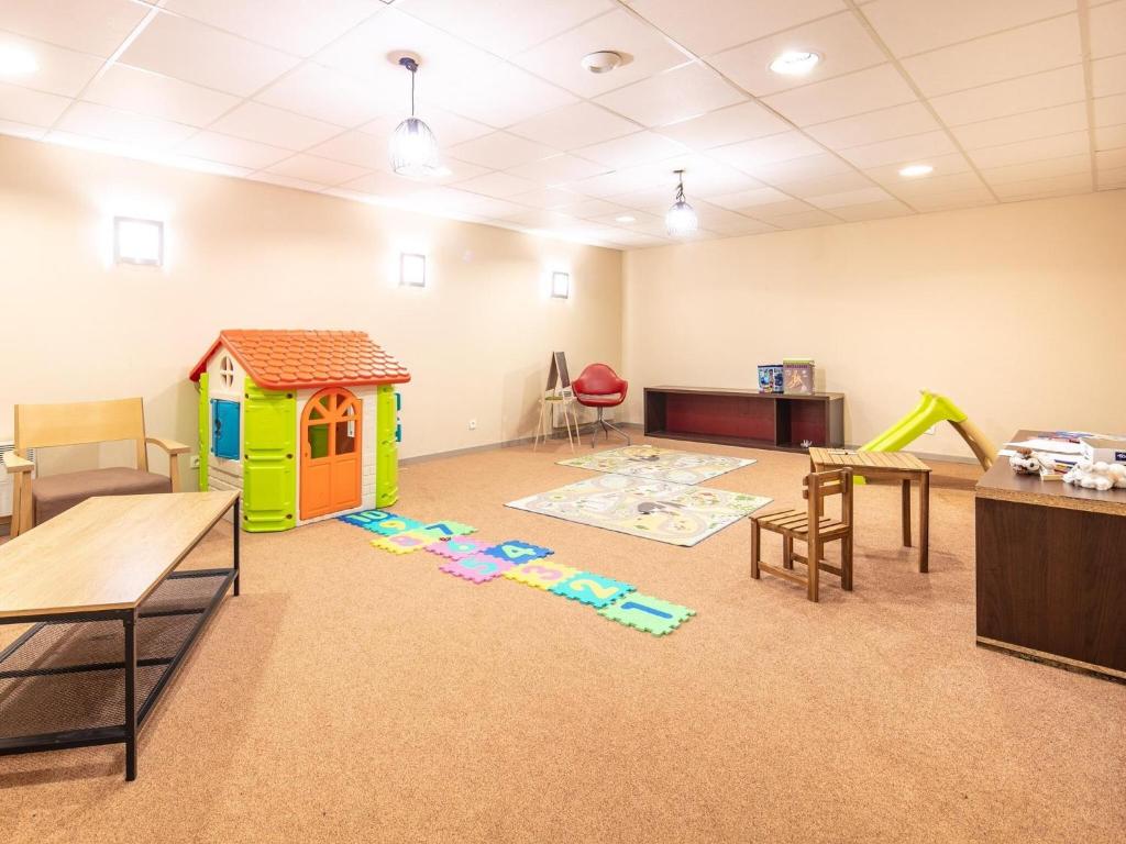a classroom with a play room with a play house at Chalet with shuttle bus in Gresse in Gresse-en-Vercors