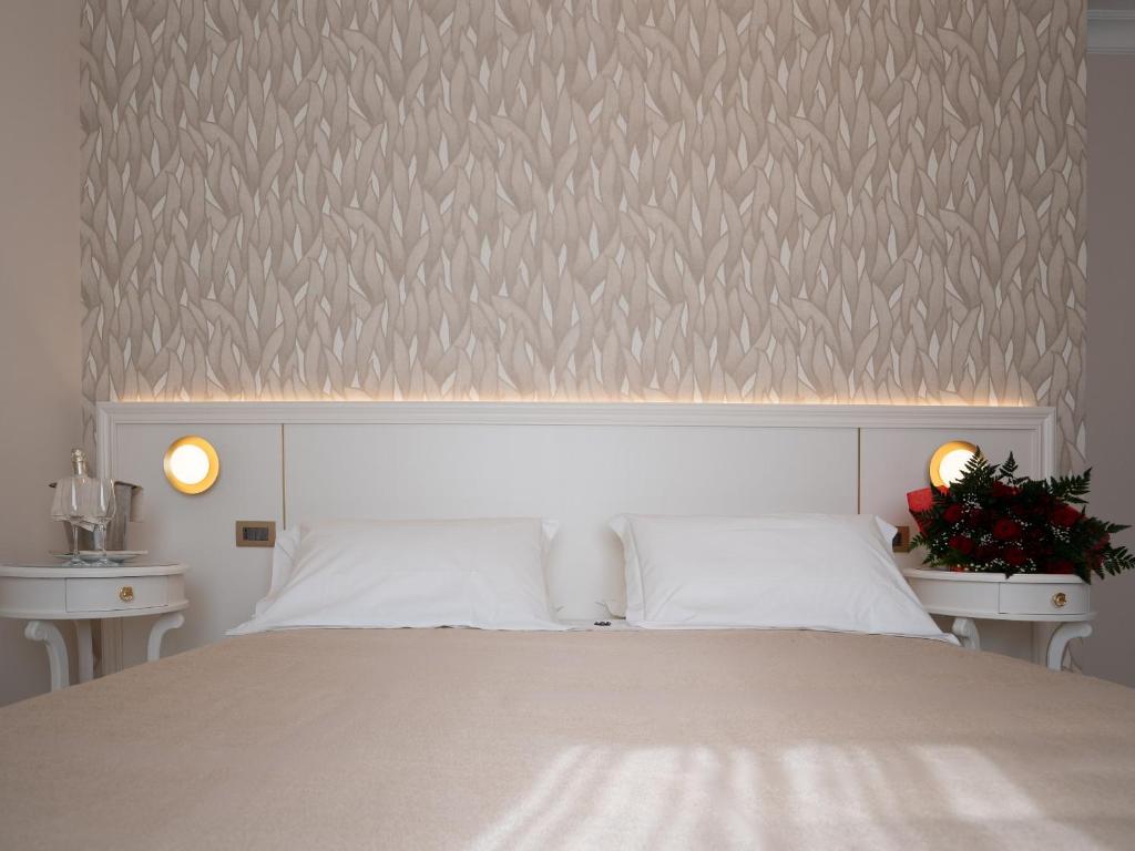 Postel nebo postele na pokoji v ubytování Hotel Sicilia
