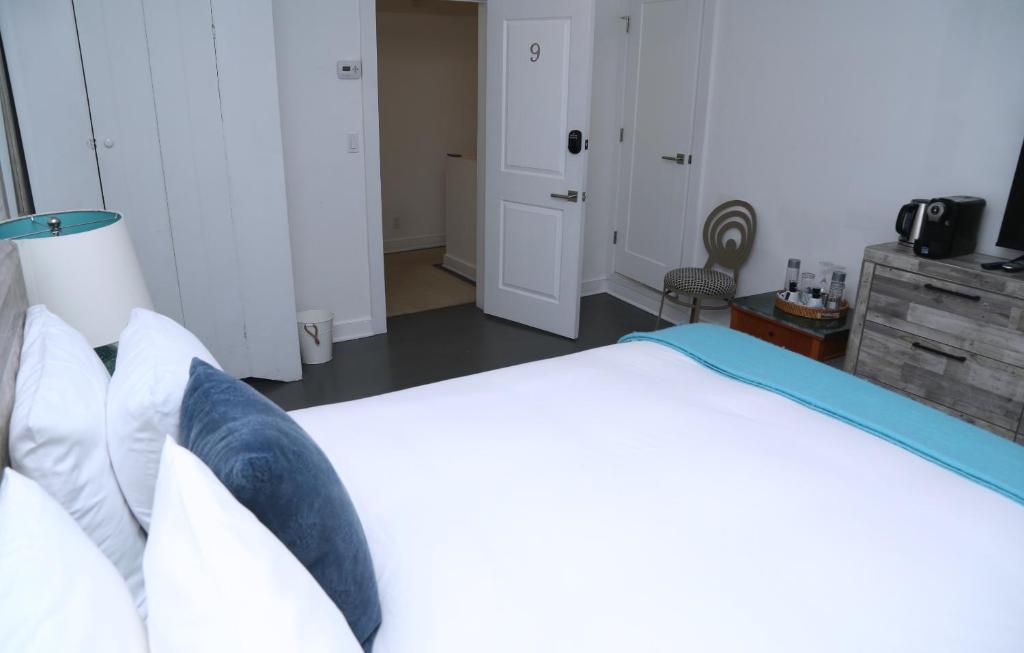 Postel nebo postele na pokoji v ubytování Harpoon House