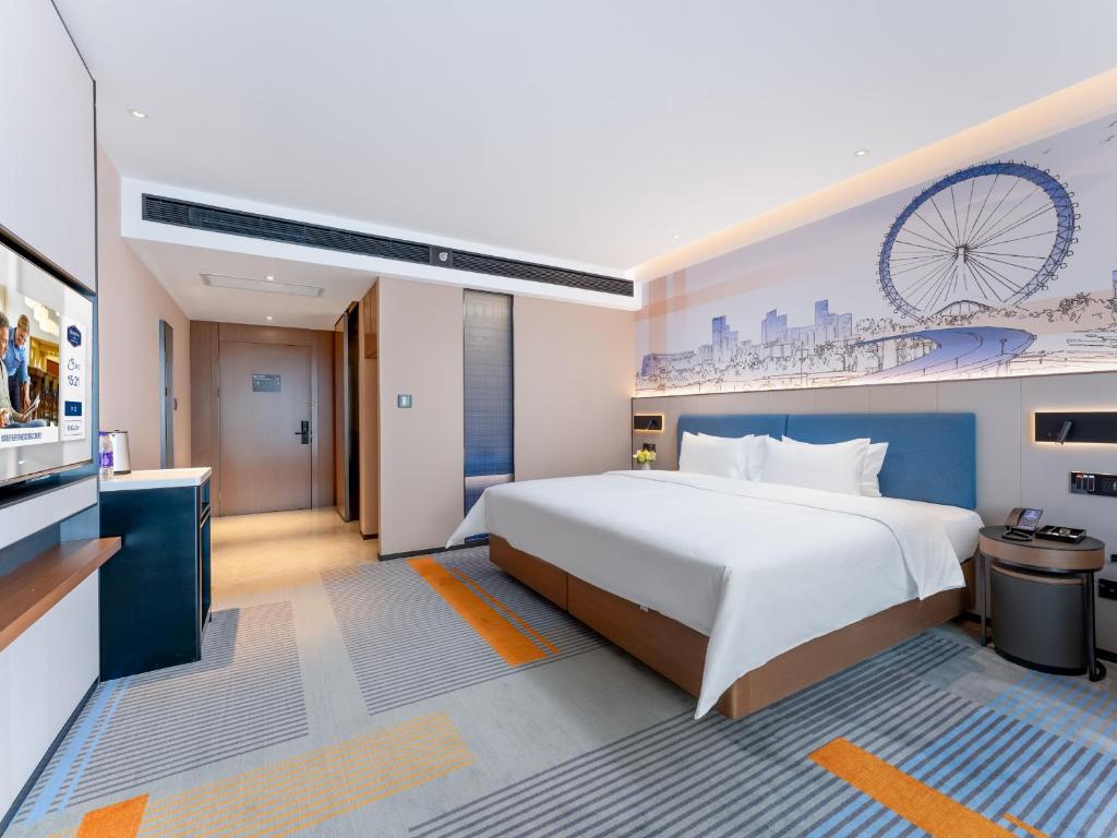 Postel nebo postele na pokoji v ubytování Hampton by Hilton Guangzhou Jinshazhou
