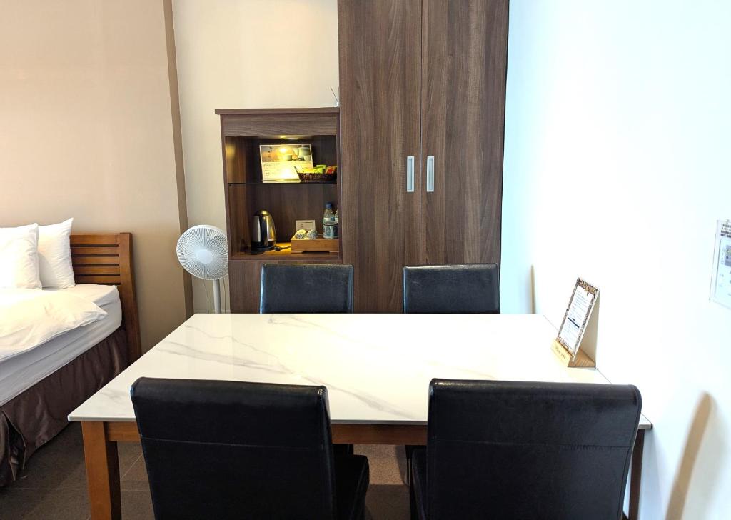 Postelja oz. postelje v sobi nastanitve Jing Guan Hotel