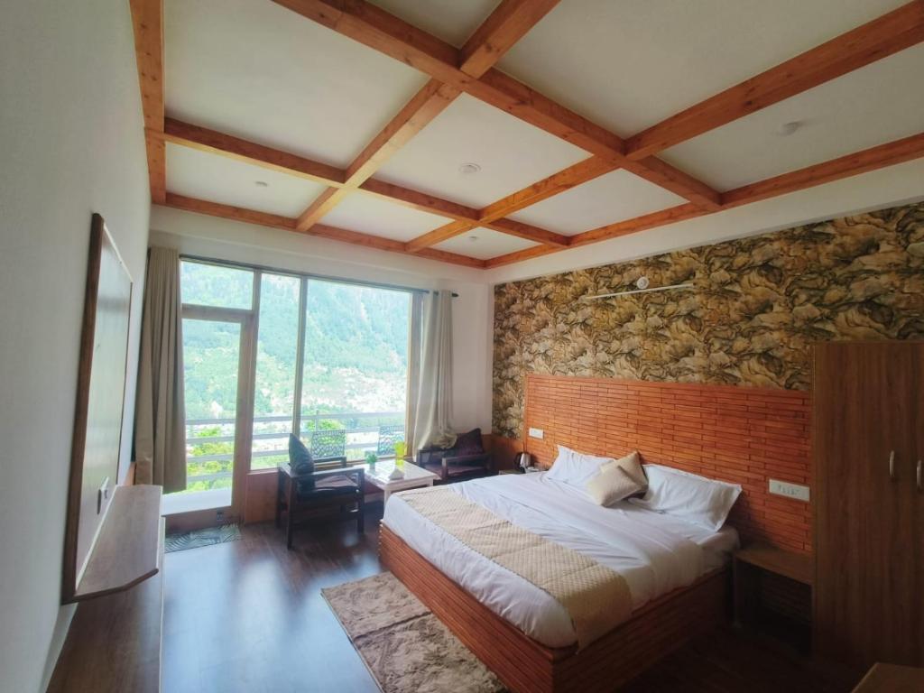 Ένα ή περισσότερα κρεβάτια σε δωμάτιο στο Aanagha Stay & cafe