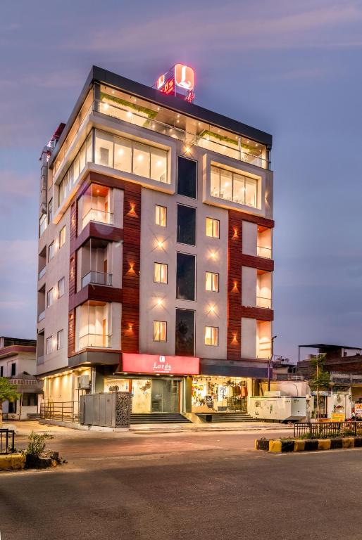 a tall building with a sign on top of it at Lords Eco Inn Jawai- Sumerpur in Sheoganj
