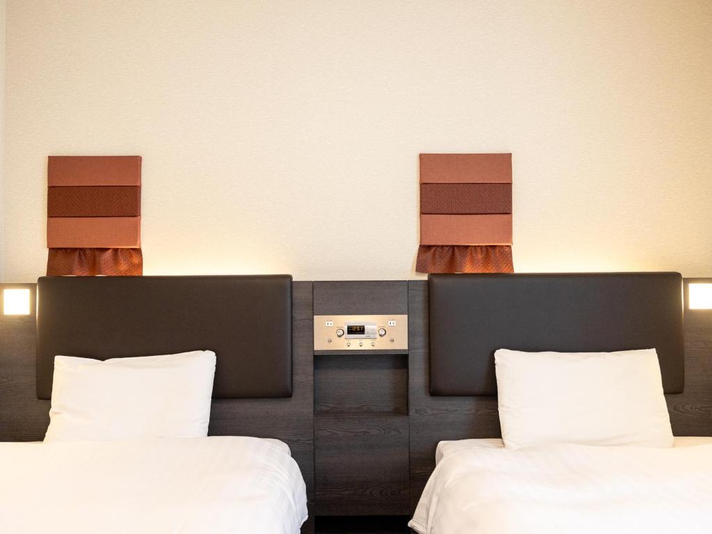 Postel nebo postele na pokoji v ubytování Comfort Hotel ERA Ise