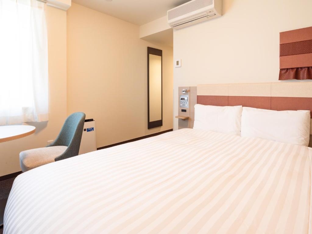 Postel nebo postele na pokoji v ubytování Comfort Hotel ERA Ise
