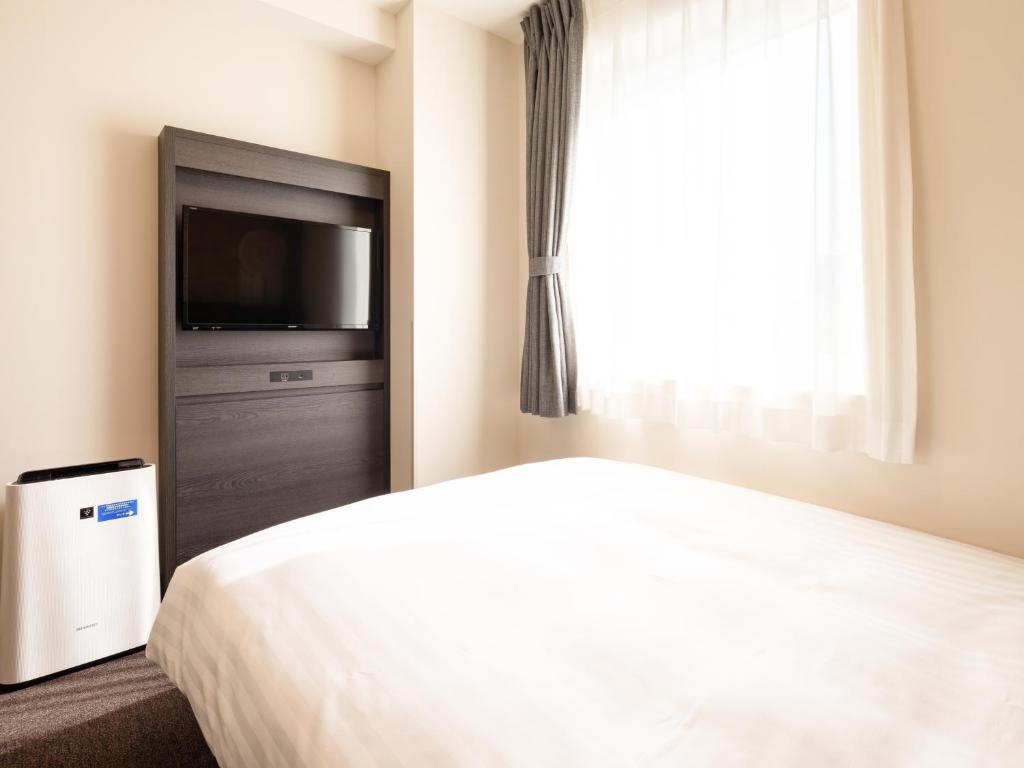 Postel nebo postele na pokoji v ubytování Comfort Hotel ERA Ise