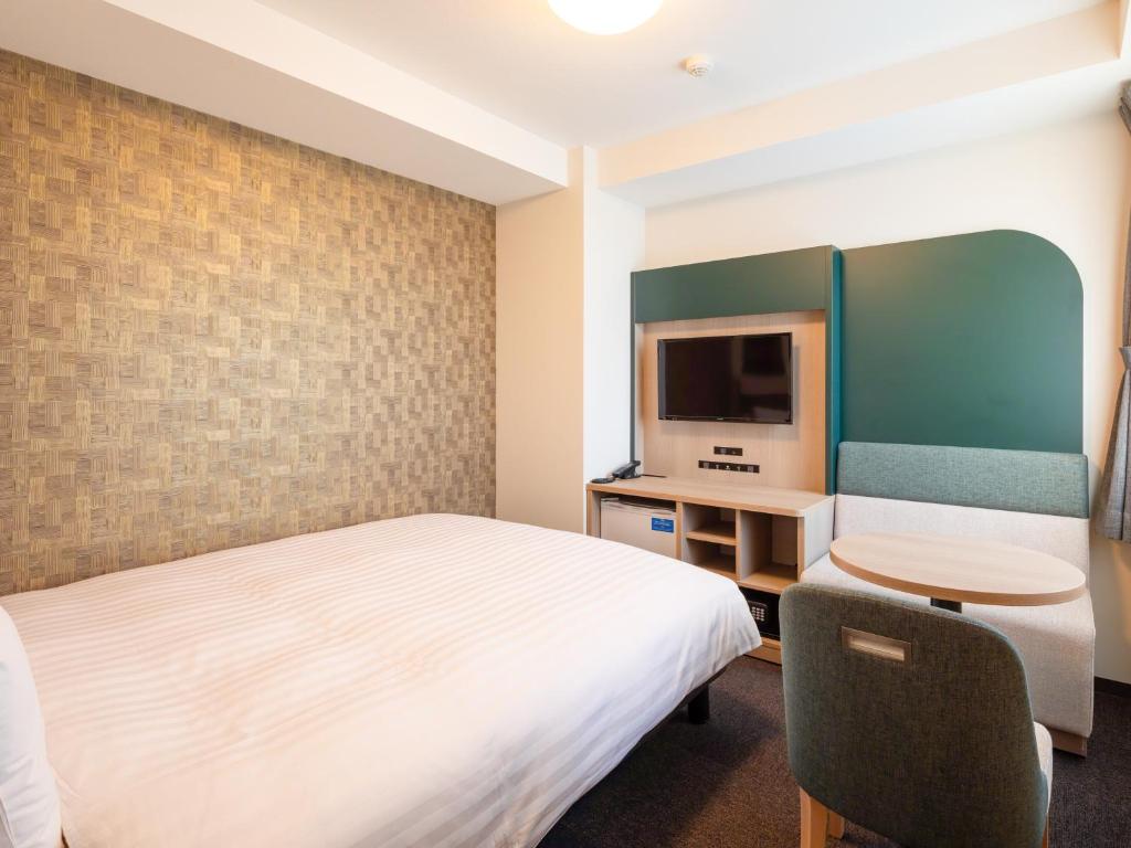 TV a/nebo společenská místnost v ubytování Comfort Hotel ERA Ise