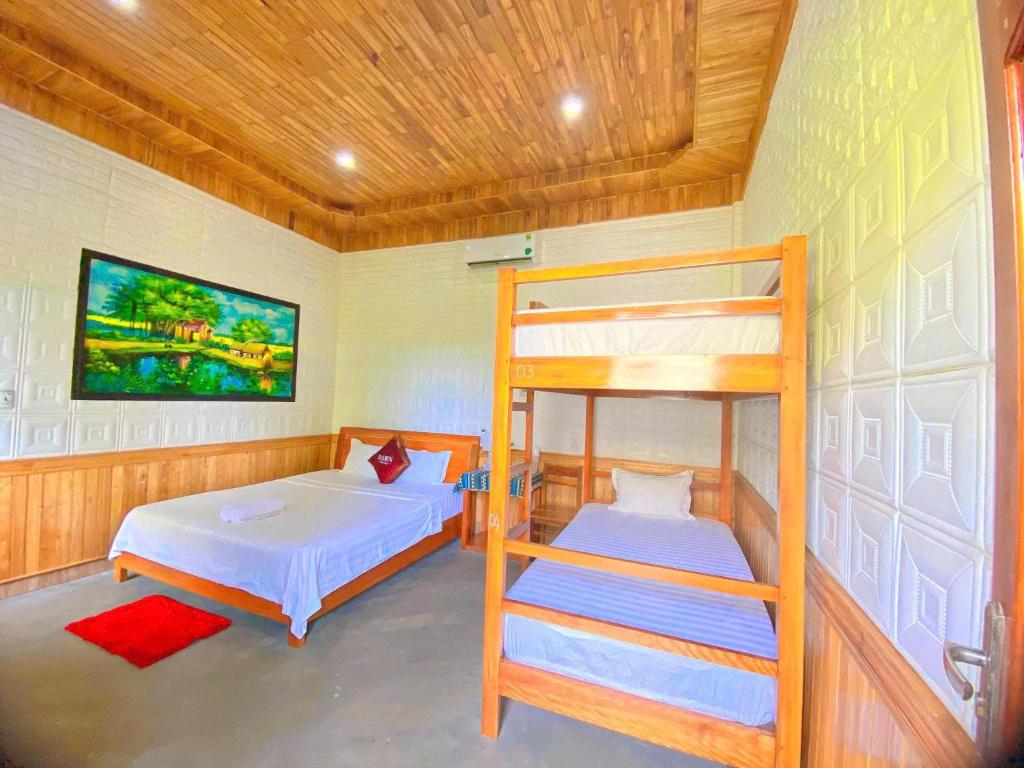 Postel nebo postele na pokoji v ubytování Phong Nha Dawn Home