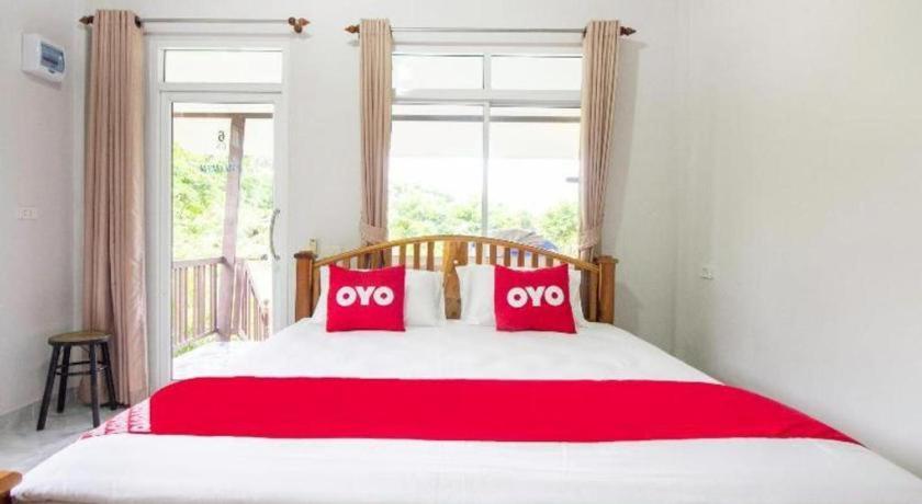 Postel nebo postele na pokoji v ubytování OYO 999 Baan Pak Rom Ruen