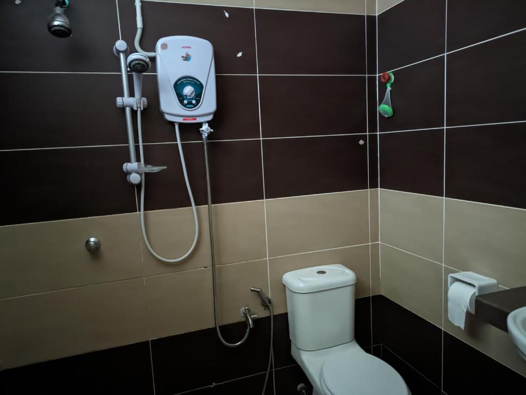 Koupelna v ubytování Nucifera Hotel Tambunan