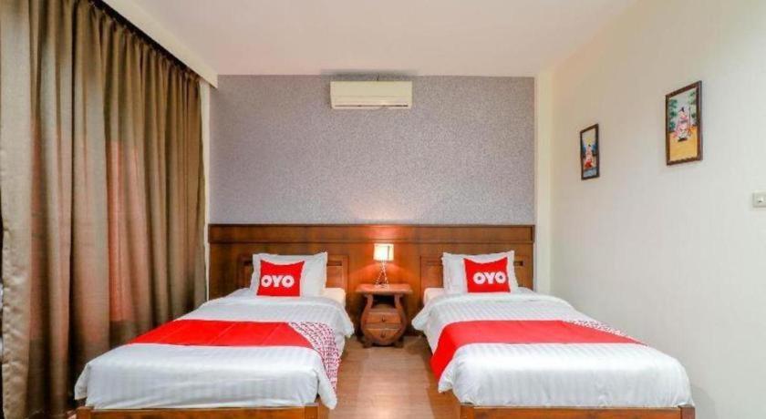 Postel nebo postele na pokoji v ubytování Tong House Resort