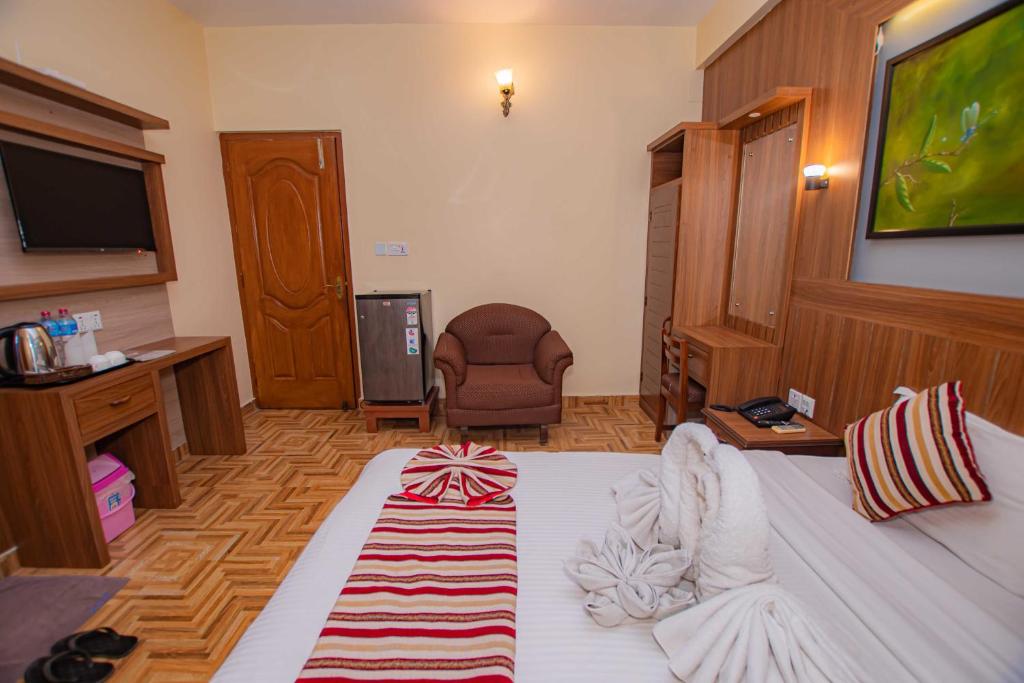 Letto o letti in una camera di Hotel Crystal Palace