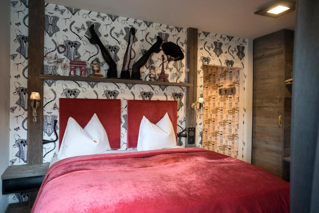 Postel nebo postele na pokoji v ubytování Boutique Hotel im Auracher Löchl