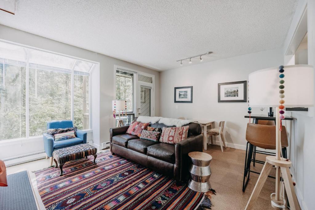 a living room with a couch and a chair at Snowater Condo 90 - Wi-Fi - Pets Ok - Fireplace in Deming