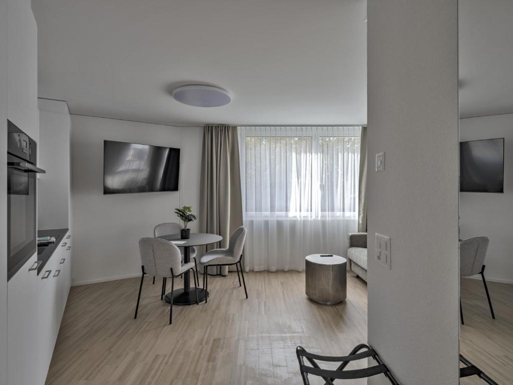TV a/nebo společenská místnost v ubytování MOOI Apartments Grenchen