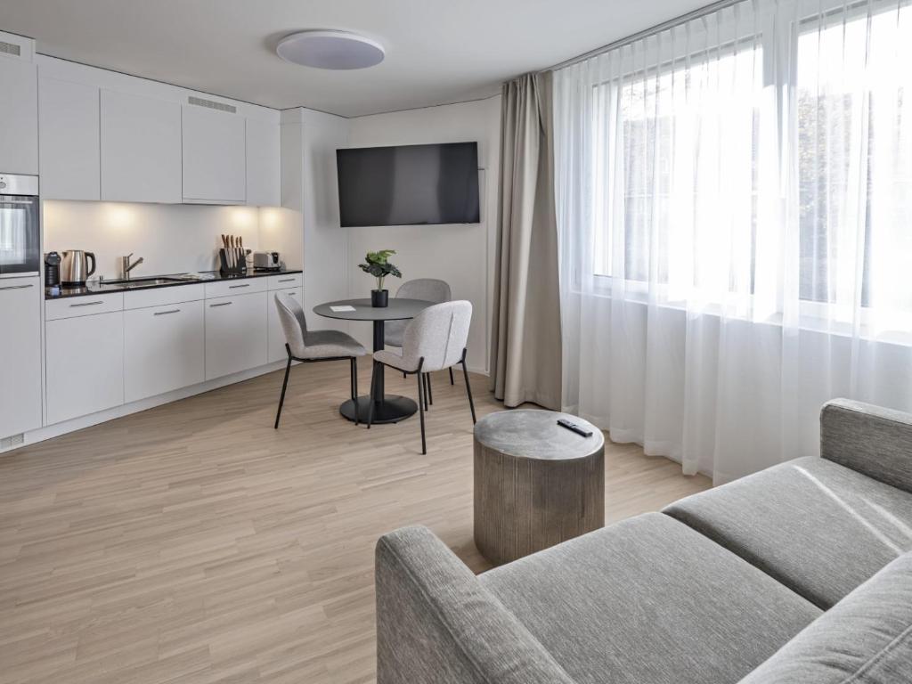 Kuchyň nebo kuchyňský kout v ubytování MOOI Apartments Grenchen