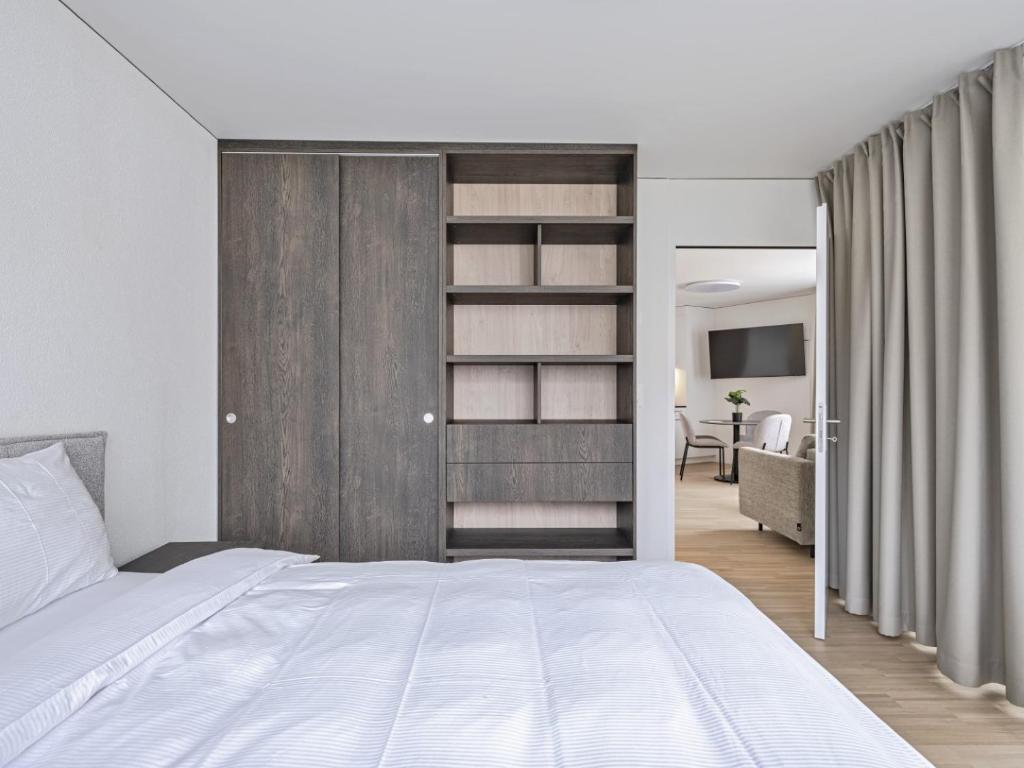 Postel nebo postele na pokoji v ubytování MOOI Apartments Grenchen