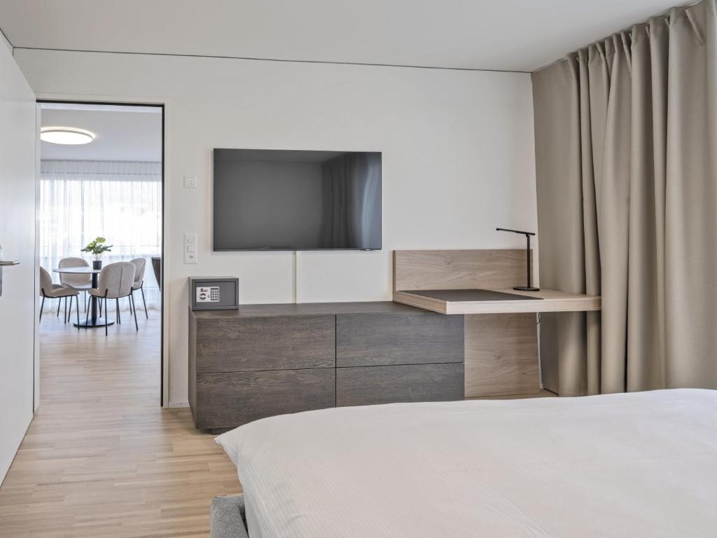 TV a/nebo společenská místnost v ubytování MOOI Apartments Grenchen
