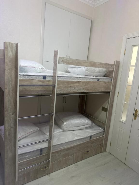 Postel nebo postele na pokoji v ubytování MI Hostel