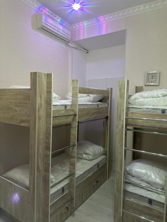 Postel nebo postele na pokoji v ubytování MI Hostel