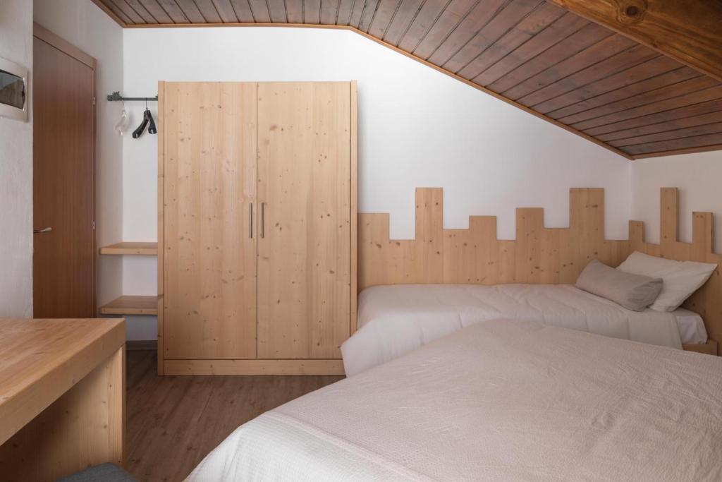 Postel nebo postele na pokoji v ubytování Hotel Miralago
