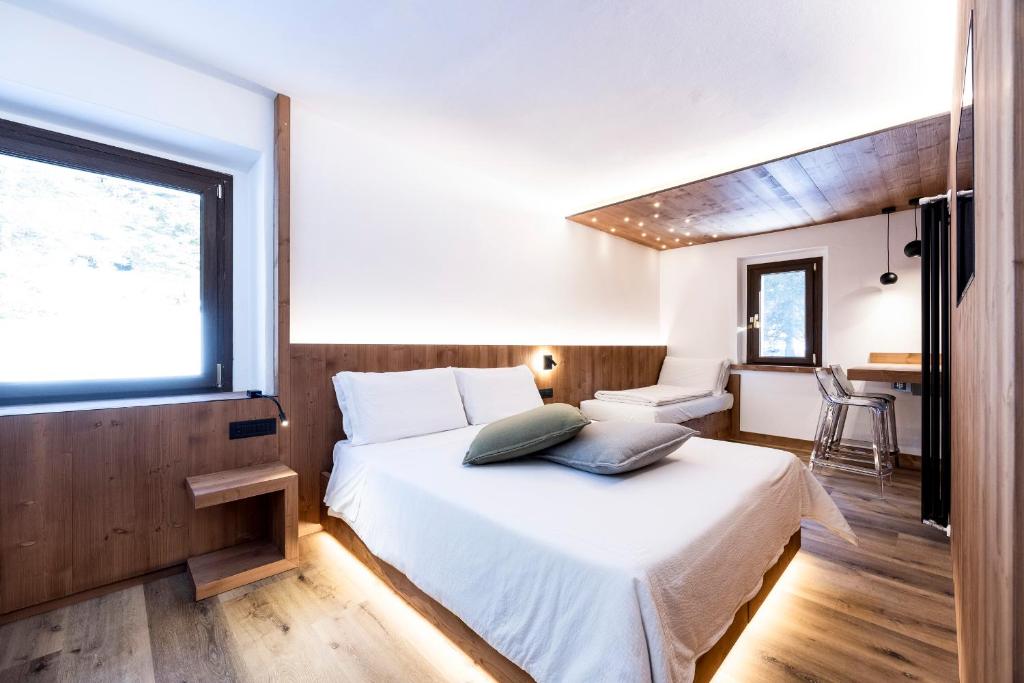 Postel nebo postele na pokoji v ubytování Hotel Miralago