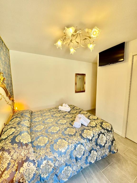 Postel nebo postele na pokoji v ubytování Ca' Antico Monastero